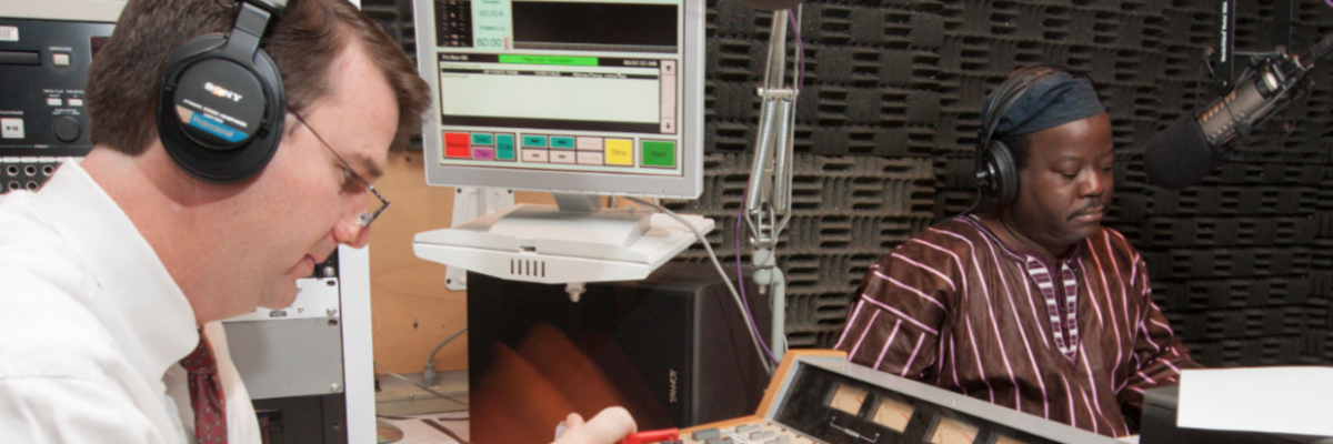 WUGA operations manager Michael Cardin and "African Perspectives" radio show host Akinloye Ojo prepare for the show's 10 year anniversary broadcast.