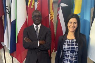 CenHTRO Director David Okech and Associate Director Lydia Aletraris photographed at the International Labour Organization headquarters at the United Nations in Geneva, Switzerland