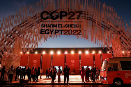 Attendees outside the main entrance of the UNFCCC COP 27 climate conference in Sharm El Sheikh, Egypt. Credit: Mohamed Abed/Getty Images